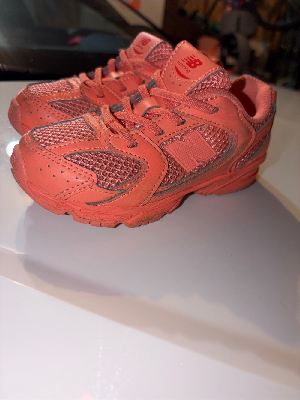 New Balance Kids Coral/Pink Athletic Sneakers VIBRANT. COMFORTABLE